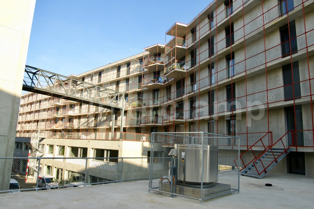 Interclamp tube clamp fittings used to create strong and secure walkway guardrails for a student accommodation block in Switzerland, ensuring student safety.